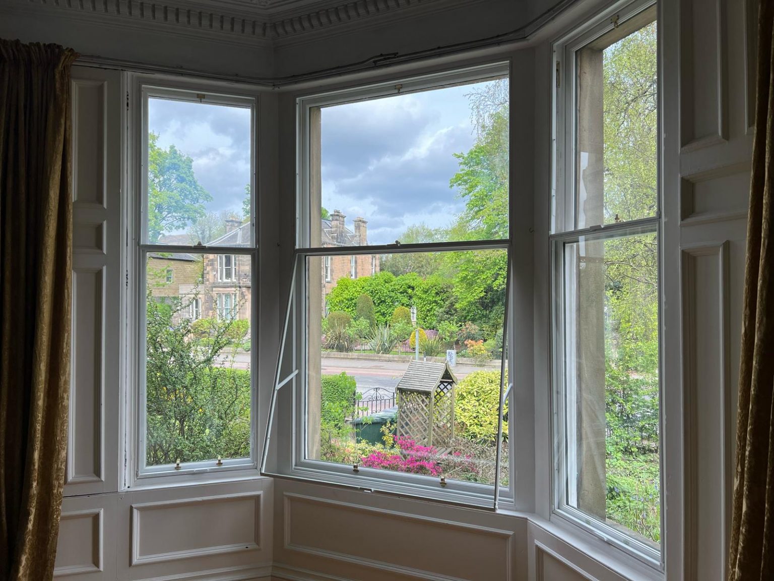 Secondary glazing panel open for ventilation on sash window